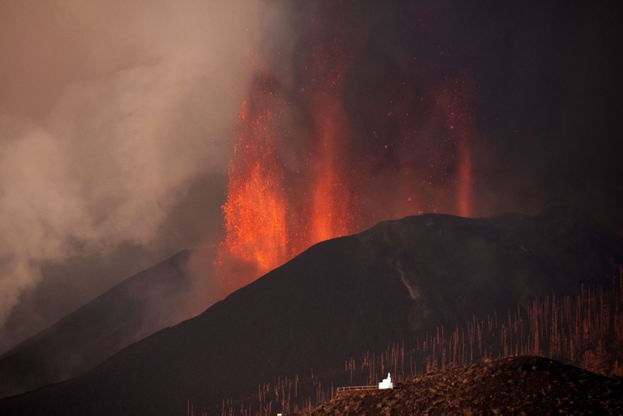 Lava spews into the air from a volcanic fissure.