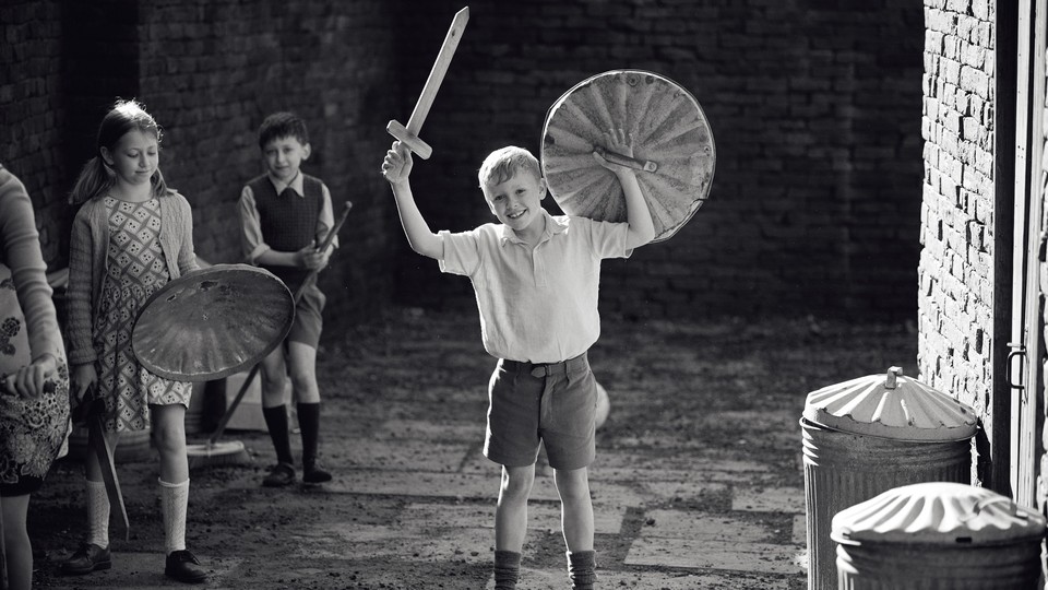 Jude Hill holding a play sword and shield in "Belfast"