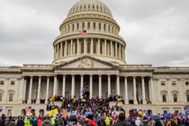 A color photograph of Trump supporters storming the U.S. Capitol Building on January 6, 2021.