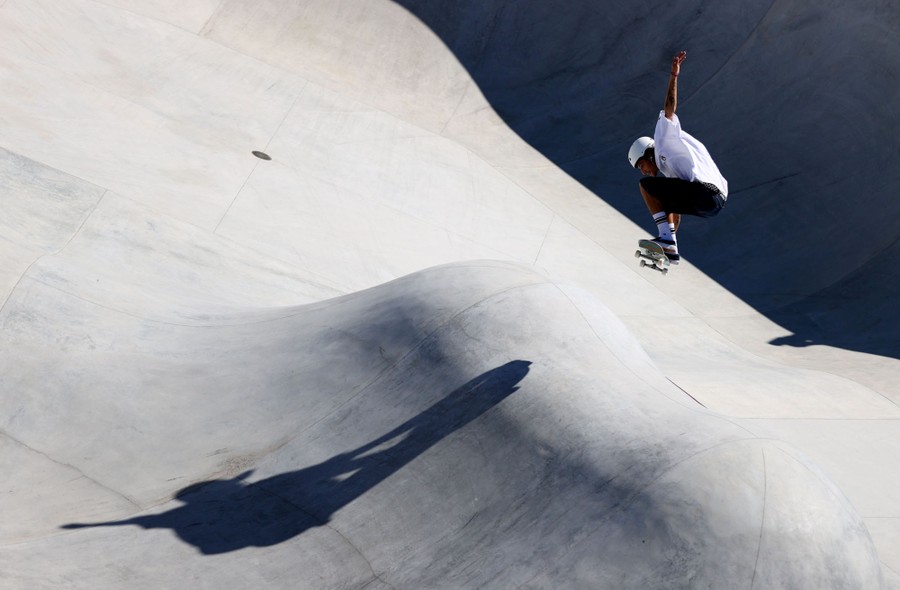 A skateboarder jumps during a competition.