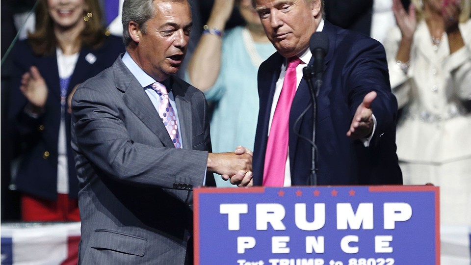 Donald Trump welcomes Nigel Farage to speak at a campaign rally in Jackson, Mississippi, on August 24.