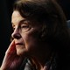 A picture of Dianne Feinstein with her hand to her cheek