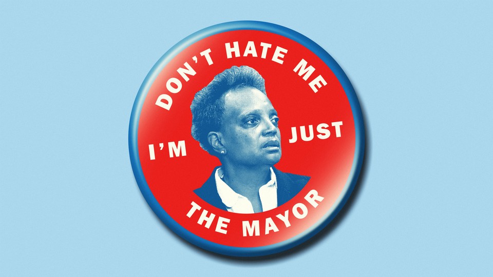 A pin showing Chicago Mayor Lori Lightfoot's face surrounded by the words "Don't hate me I'm just the mayor"
