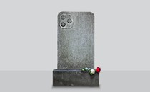 A tombstone in the shape of an iPhone