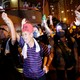 Protesters wearing gas masks and makeshift body armor march in the streets of Hong Kong.