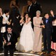 Jonathan Wang accepting the Best Picture Oscar for "Everything Everywhere All at Once," with the rest of the cast and crew behind him