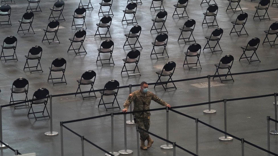 Rows of empty chairs at a mass-vaccination site