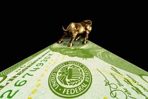 A golden bull on a U.S. dollar