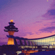 A stylized, dreamy sunset view of Washington Dulles International Airport