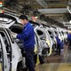 Employees work at a General Motors plant in China.