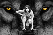 A staring wolf and a girl kneeling