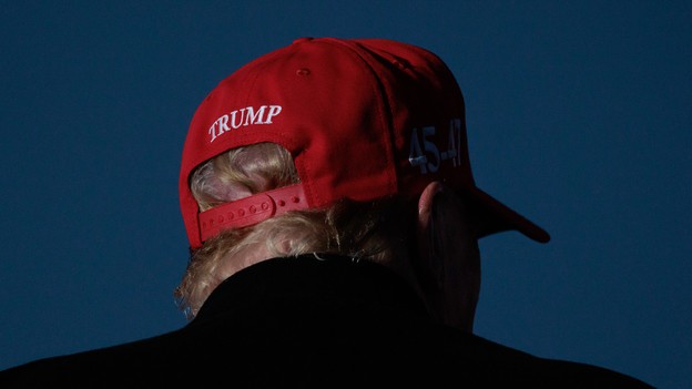 A photo image of Donald Trump wearing a MAGA cap.
