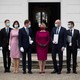 Slovakia's government stands in a row while wearing masks.