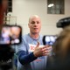 The congressional candidate J. D. Scholten talks to reporters.