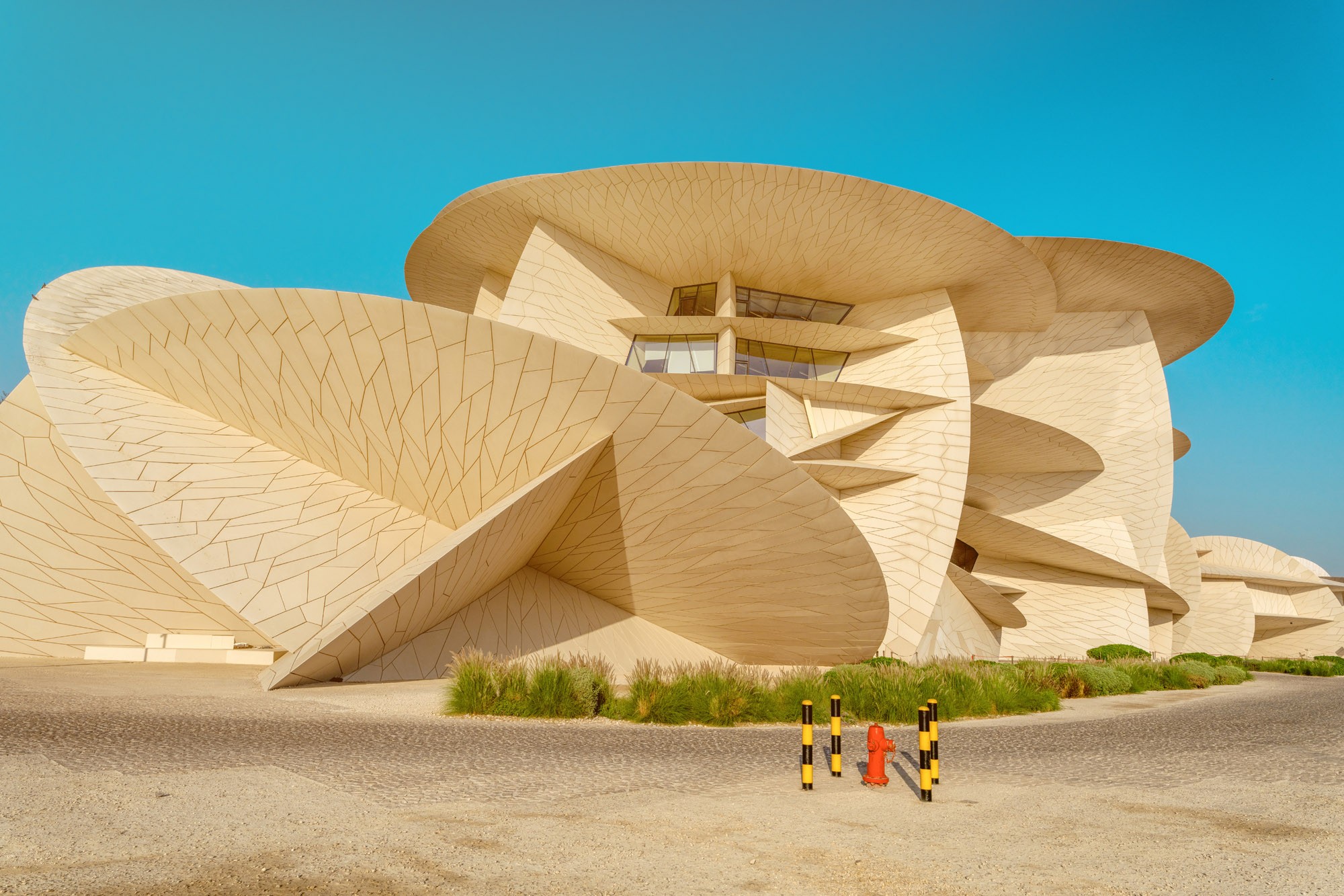 A view of the exterior of a modern museum, which has been built with many interlocking disc shapes.