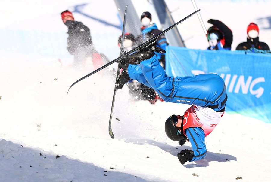 A skier is seen tumbling down a slope after a fall.