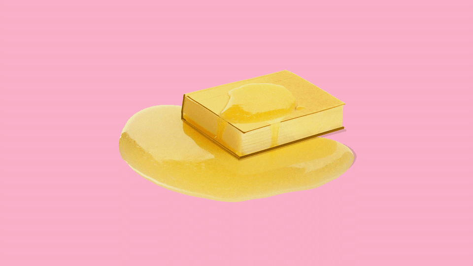 A golden book with a pat of butter melting on top of it, resembling a pancake