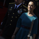 Mexican President Claudia Sheinbaum in a blue dress, standing next to person wearing military uniform