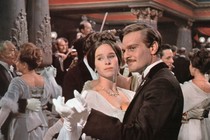 Omar Sharif and Geraldine Chaplin dance in a ballroom