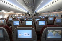Rows of airplane seats viewed from behind