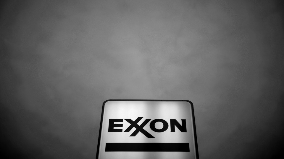 An Exxon sky lit against a black sky