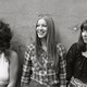 The three members of the Shangri-Las standing in front of a wall
