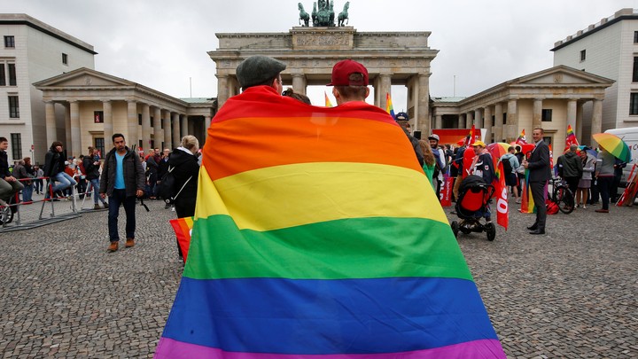 People celebrate Germany’s legalization of same-sex marriage in front of the Brandenburg Gate in Berlin on June 30, 2017.