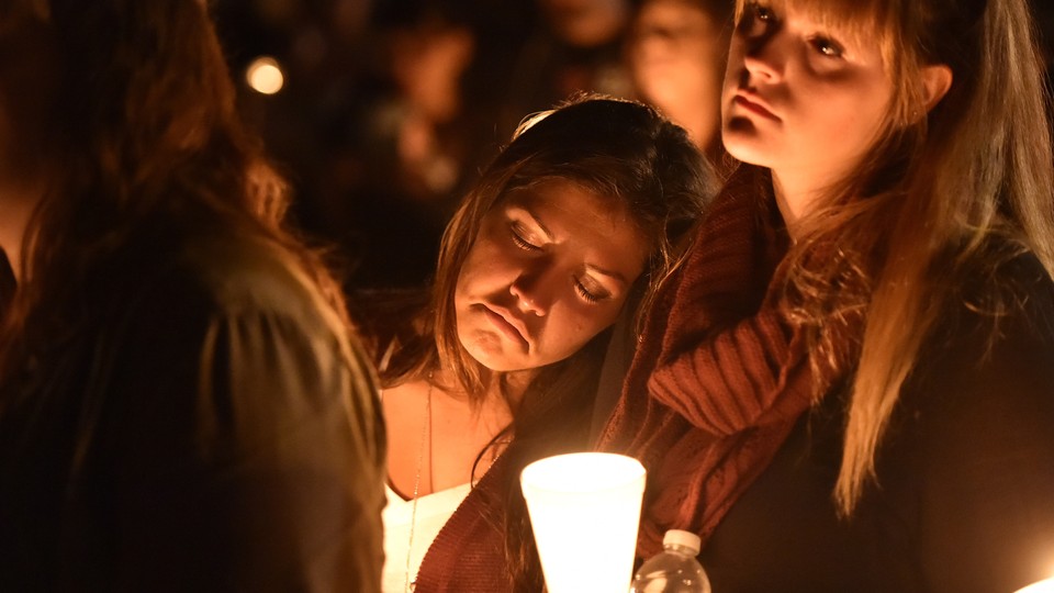 A student at Umpqua Community College mourns during a vigil in Roseburg, Oregon, on October 1, 2015.