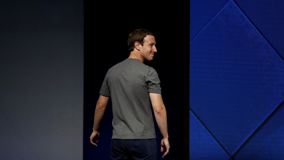 Mark Zuckerberg looks over his shoulder.
