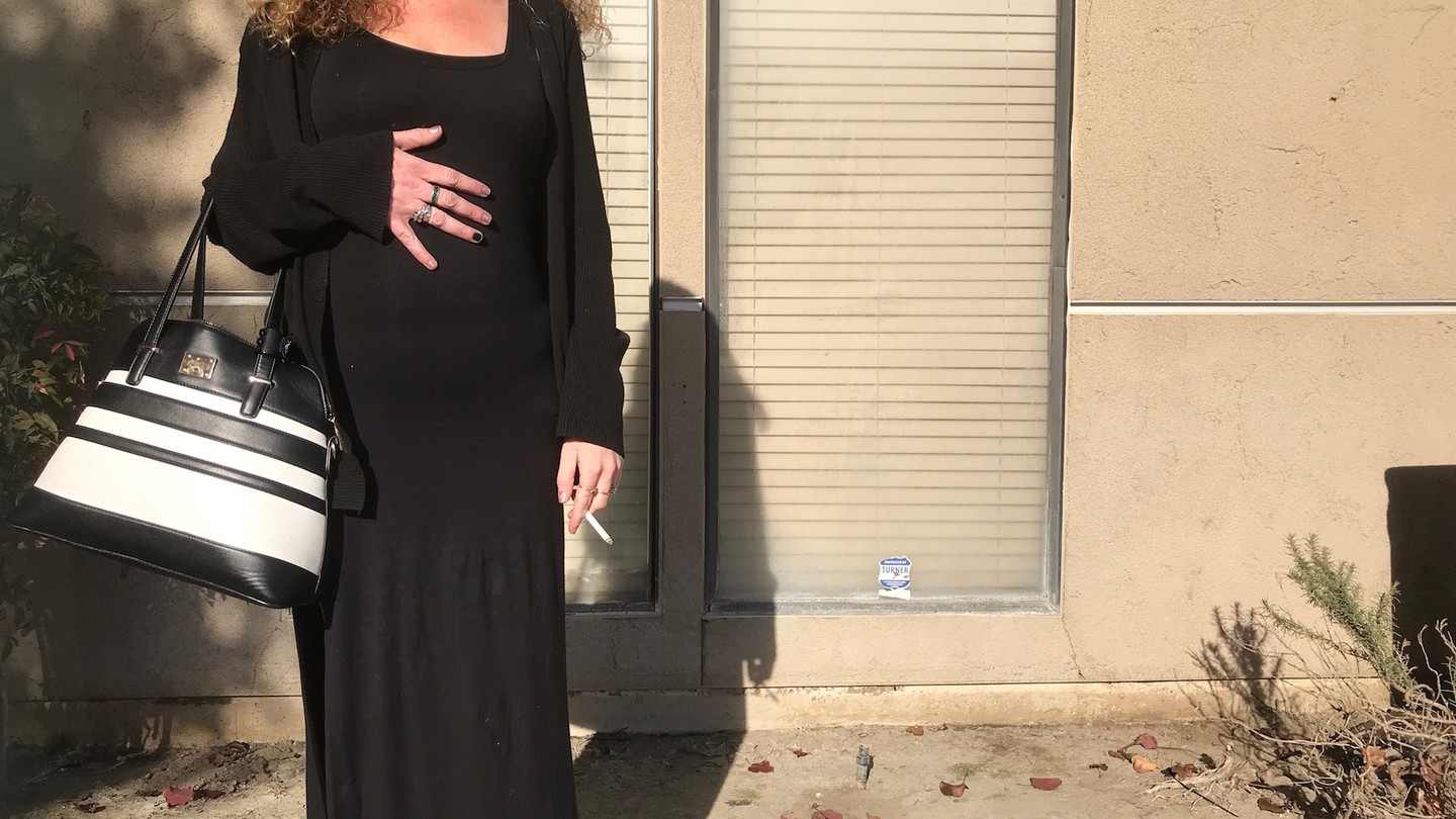 Amanda, seven months pregnant, outside the methadone clinic in Fresno, CA.