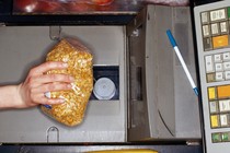 Photo of a bag of peanuts being scanned at checkout