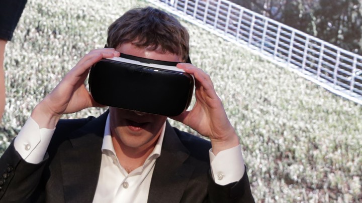 Mark Zuckerberg wears a pair of virtual-reality goggles.