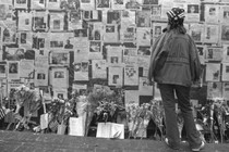 A woman looks at photos of those who went missing on September 11 in New York City.