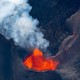 A volcano spewing red and orange lava