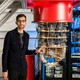 Google CEO Sundar Pichai stands beside a quantum computer.