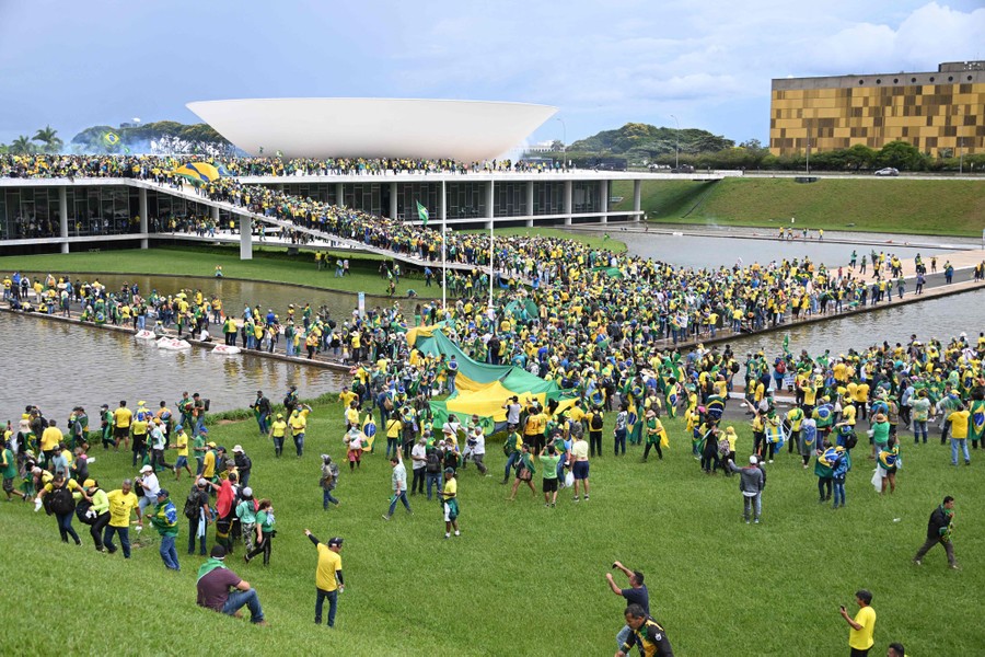 A large crowd of protesters crowd into government buildings and grounds in Brazil.