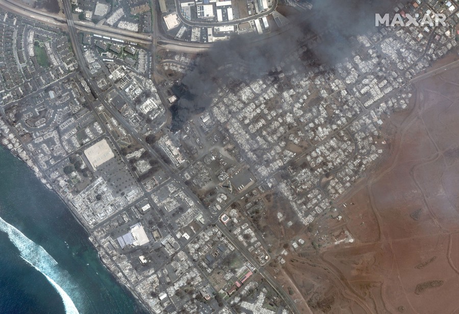 A satellite image shows fire damage in an overview of a burned town.