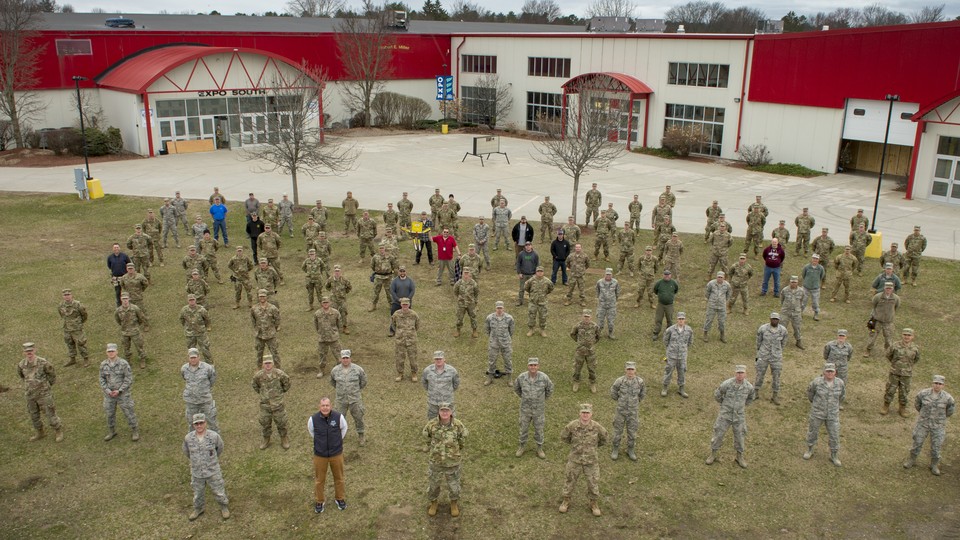 Photo of the Vermont National Guard in front of an expo center that they converted into a hospital