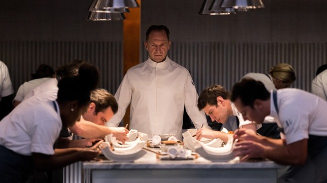 Ralph Fiennes as Chef Slowik, presiding over a kitchen table in "The Menu"