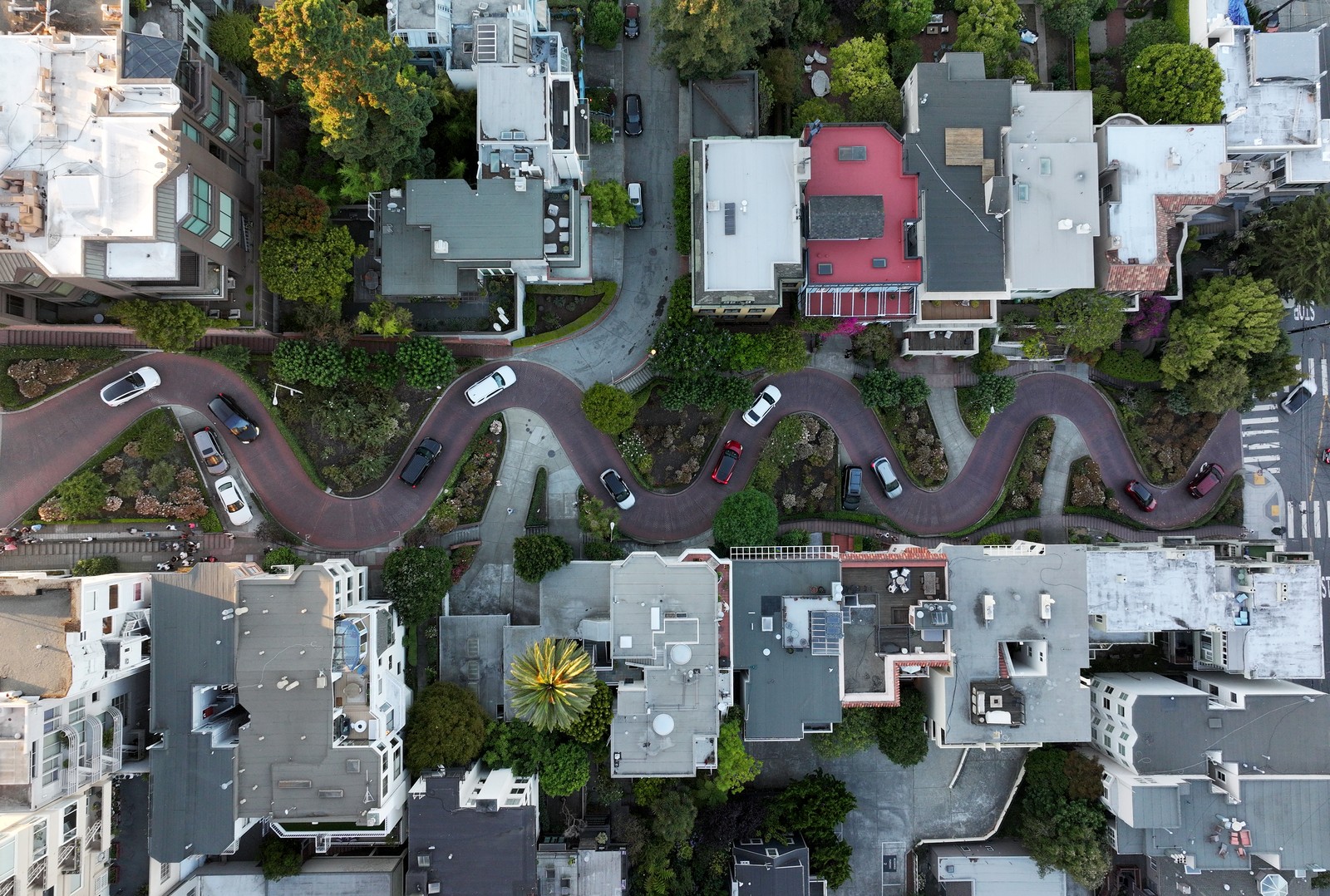A top-down aerial view of a winding Road through a densely populated part of San Francisco.
