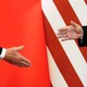 Photo showing Xi and Trump shaking hands