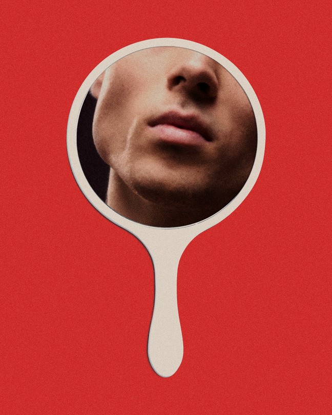 A man looking at himself in a mirror