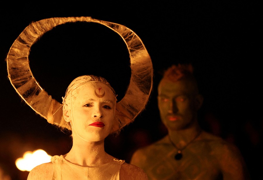 Two people in body paint and costume