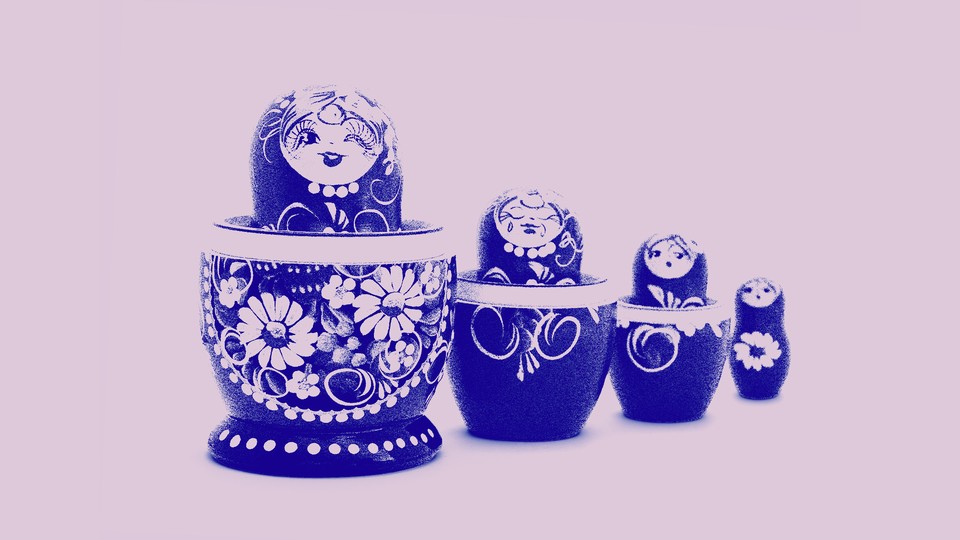 Four nesting dolls with a floral print
