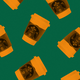 Orange-colored Starbucks cups on a green background