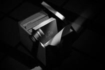 Black-and-white illustration of a legal handbook, notes, and a judge’s gavel in a cardboard box with the box’s lid leaning on the side