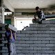 Two workers lay stones in order to rebuild a shop that was destroyed during fighting between Iraqi forces and Islamic state fighters in Mosul, Iraq.