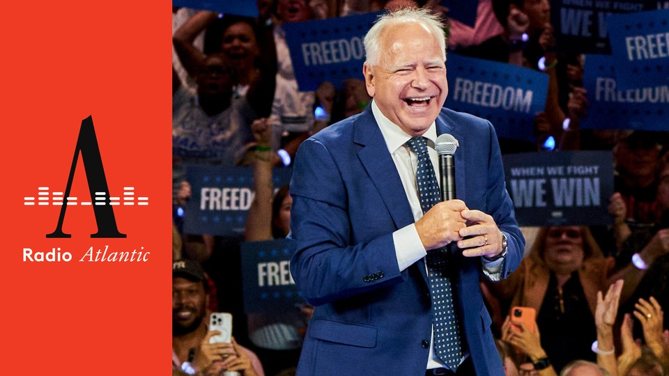 Minnesota Governor Tim Walz laughing with a microphone.