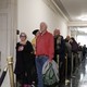 Members of the public wait in line hoping to get into the hearing room as former U.S. Ambassador to Ukraine Marie Yovanovitch arrives to testify.