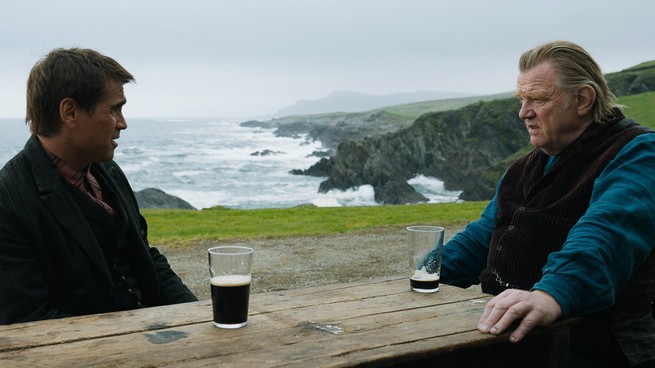 Colin Farrell and Brendan Gleeson squinting at each other over beers in "The Banshees of Inisherin"